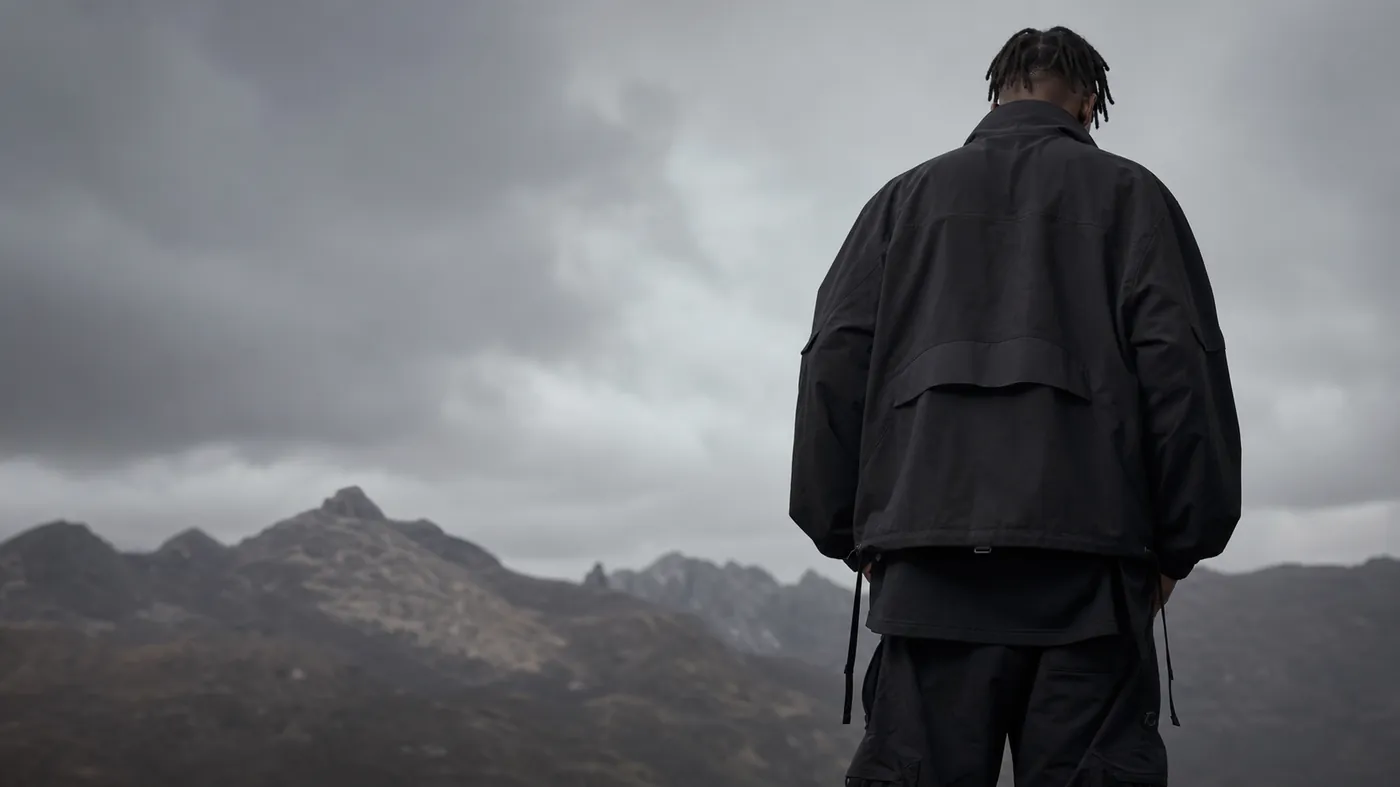 Model wearing an oversized black Blvck Threads jacket
