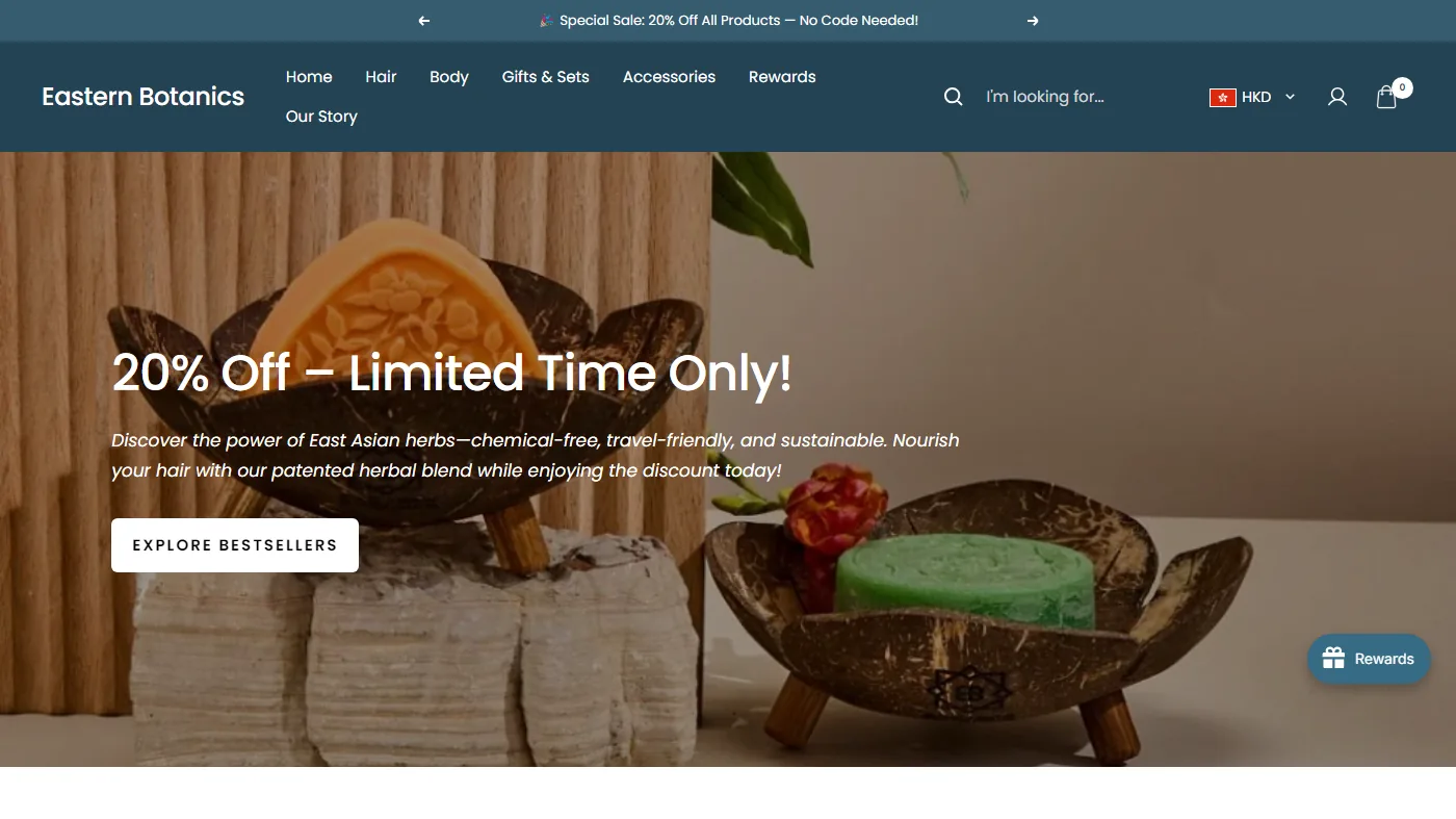 The Eastern Botanics homepage: a teal header with an HKD switcher, over a hero showing two herbal shampoo bars in coconut-shell dishes.